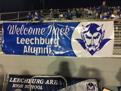 Welcome back Leechburg alumni sign hangs at a Friday night football game